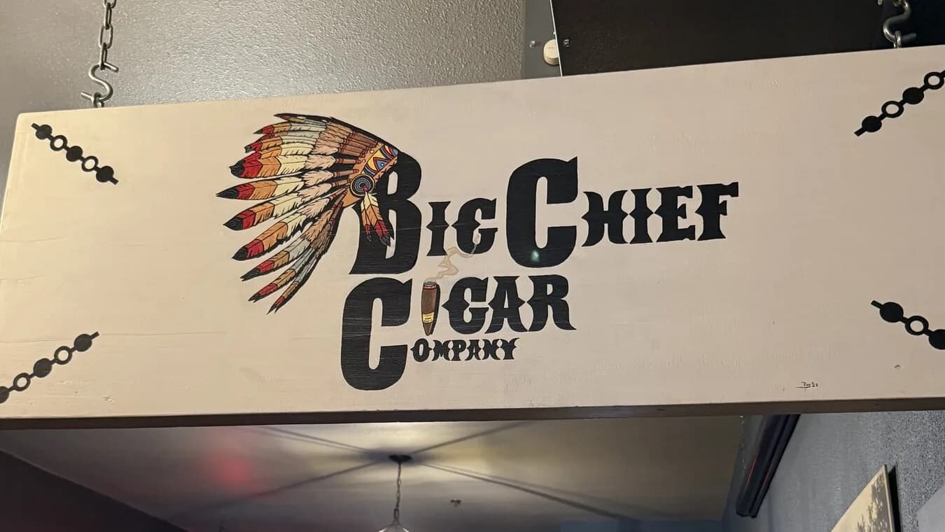 The hand-painted Big Chief Cigar Company sign hanging inside the shop